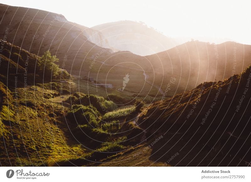 View to sunny hills Hill Vantage point Mountain Sunbeam Landscape Vacation & Travel Nature scenery Rock Grass Summer Valley Peak Scene Tourism Seasons