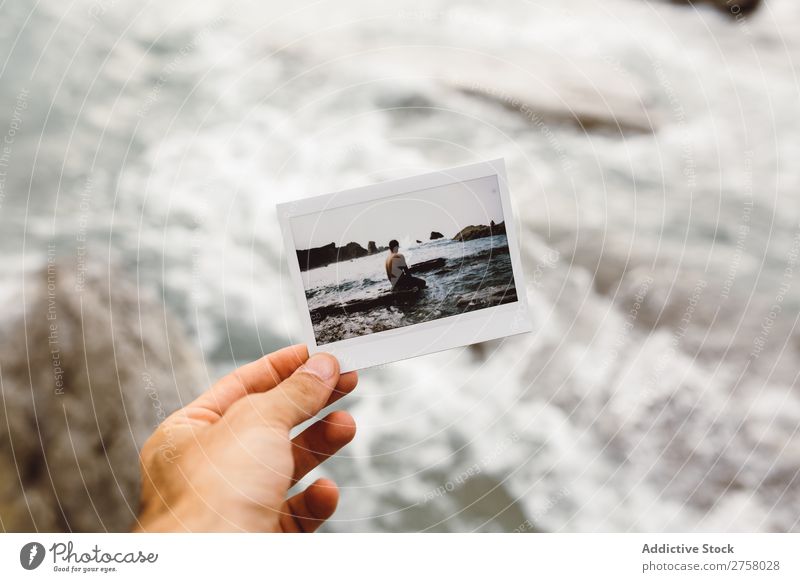 Hand with shot of man on shore Man Tourist Cliff Shot instant Ocean Rock Vacation & Travel Tourism Nature Landscape Coast Water Sun Freedom Stone Natural