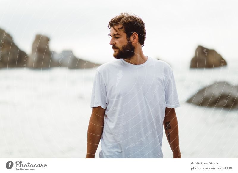 Man standing on rocky beach Tourist Cliff Ocean Rock Vacation & Travel Tourism Nature Landscape Coast Water Sun Freedom Stone Natural Lifestyle Beautiful