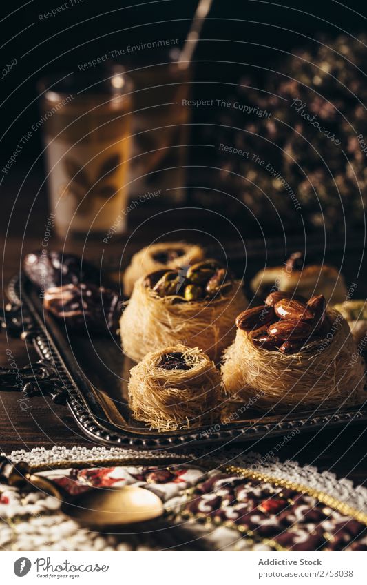 Syrian pastry dessert on dark background Above arabic Breakfast Brown bulbul Cooking Dark Delicious Dessert Dish Drinking Food Fork Glass Gourmet indoor Kettle