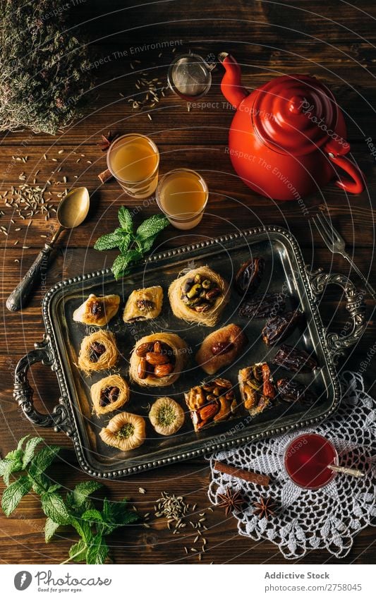 Syrian pastry with tea on a wooden table Above arabic Breakfast Brown Cooking Delicious Dessert Dish Drinking Food Fork Glass Gourmet indoor knafeh Mint Nest