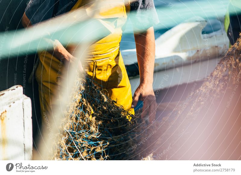 Man working with fishing net Ball bobber Buoy Colour Multicoloured Day Detail Equipment fisher Fishery fishnet Float in the water floats Horizontal Industrial