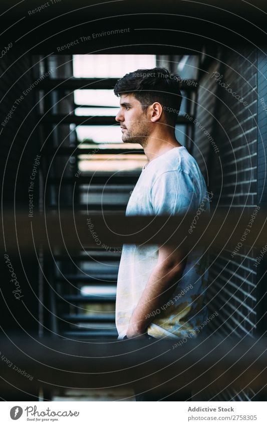 Man posing at the brick wall Wall (building) Posture Brick Stairs Profile Self-confident Youth (Young adults) Cool (slang) Human being Portrait photograph