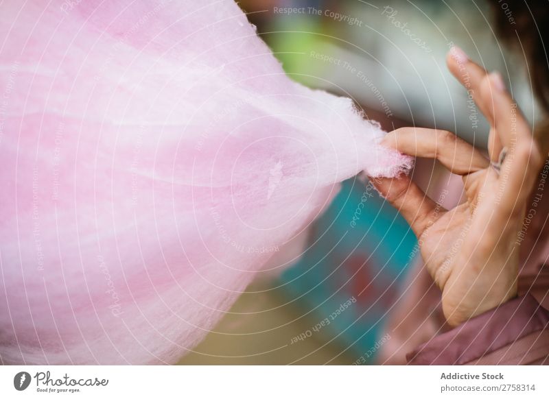 Person taking a piece of cotton candy Human being Cotton candy Pink Piece Sweet Park Food To feed Sugar Joy Hand Crops Lifestyle Portrait photograph