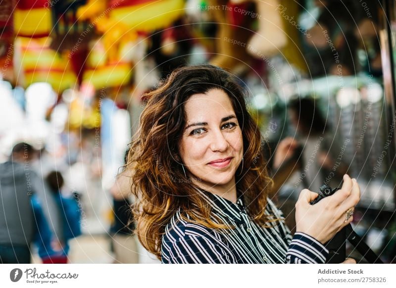 Smiling woman in the park arming the gun in a range. smiling happy cheerful load looking at camera training shooting range person pink female practice pretty