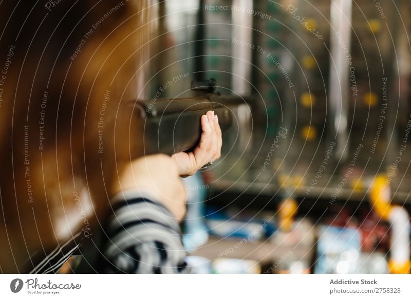 Woman aiming in shooting range Range gun Park Fitness Human being Pink Practice pretty Joy Leisure and hobbies Lifestyle Portrait photograph