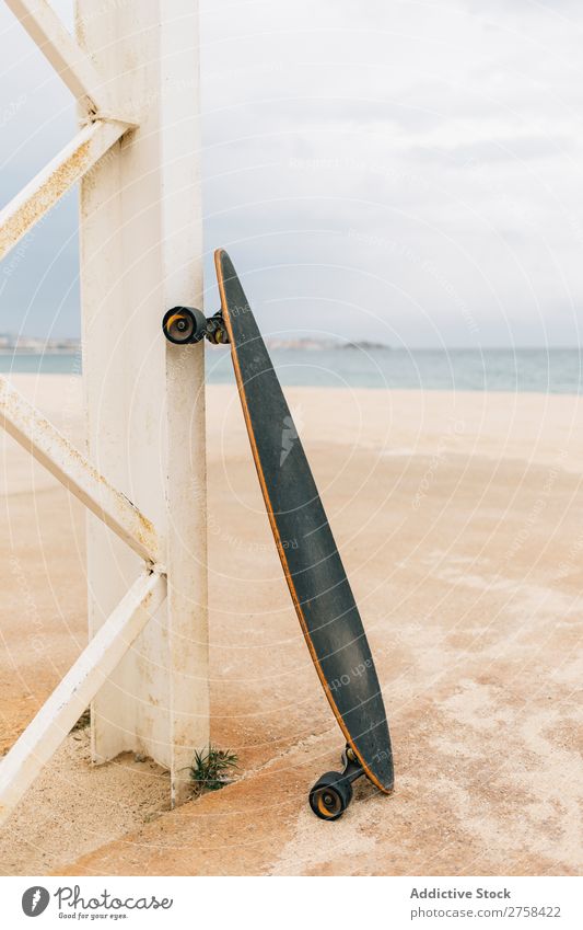 Longboard on beach Vacation & Travel Sun Sky Beautiful Deserted Exterior shot Copy Space Wooden wall Skateboard Coast Beach Leisure and hobbies Summer Sports