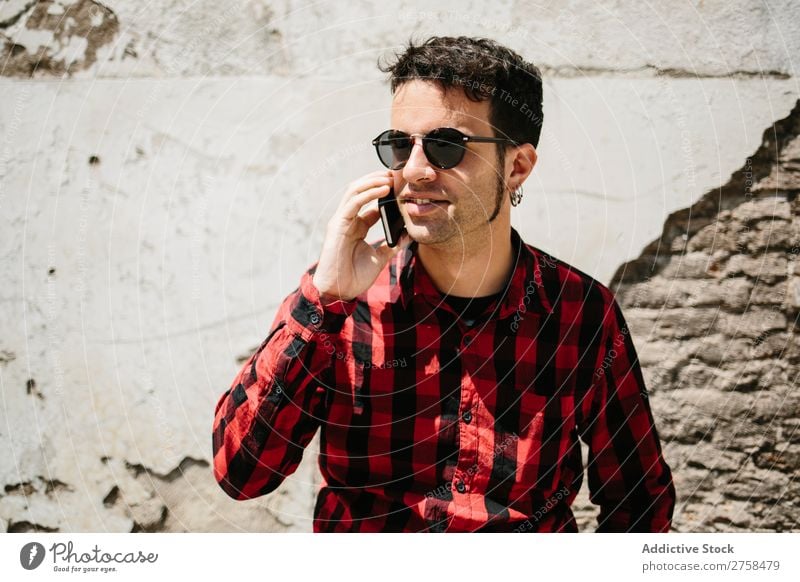 Stylish man talking phone Man PDA To talk Wall (building) Sunbeam Mobile handsome Style Cool (slang) Telephone Portrait photograph Lifestyle Communication