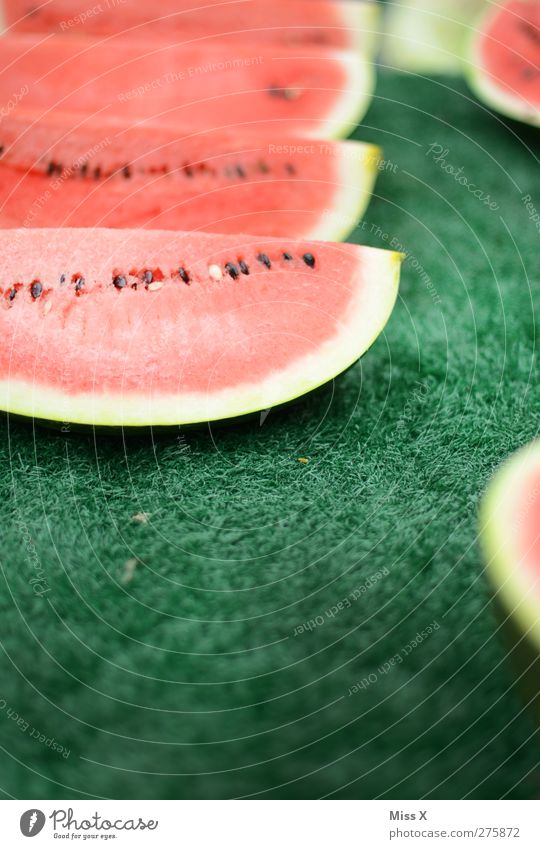 bite through Food Fruit Nutrition Organic produce Delicious Juicy Sweet Green Red Melon Water melon Part Slice Fruit seller Farmer's market Colour photo