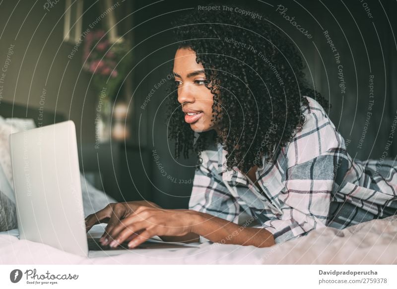 beautiful black woman on bed with laptop and cup of coffee Woman Bed Notebook Computer Smiling Portrait photograph Close-up Technology Internet wifi device