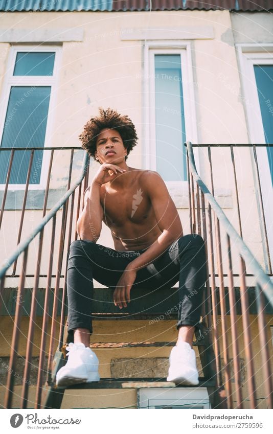 shirtless young black man sitting in the stairs Man Black Youth (Young adults) Athlete Naked Torso Human being Mixed race ethnicity Afro Curly hair Healthy Body