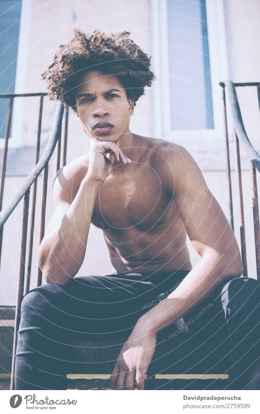 shirtless young black man sitting in the stairs Man Black Youth (Young adults) Athlete Naked Torso Human being Mixed race ethnicity Afro Curly hair Healthy Body