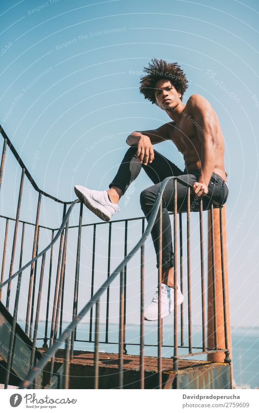 shirtless young black man sitting in the stairs Man Black Youth (Young adults) Athlete Naked Torso Human being Mixed race ethnicity Afro Curly hair Healthy Body