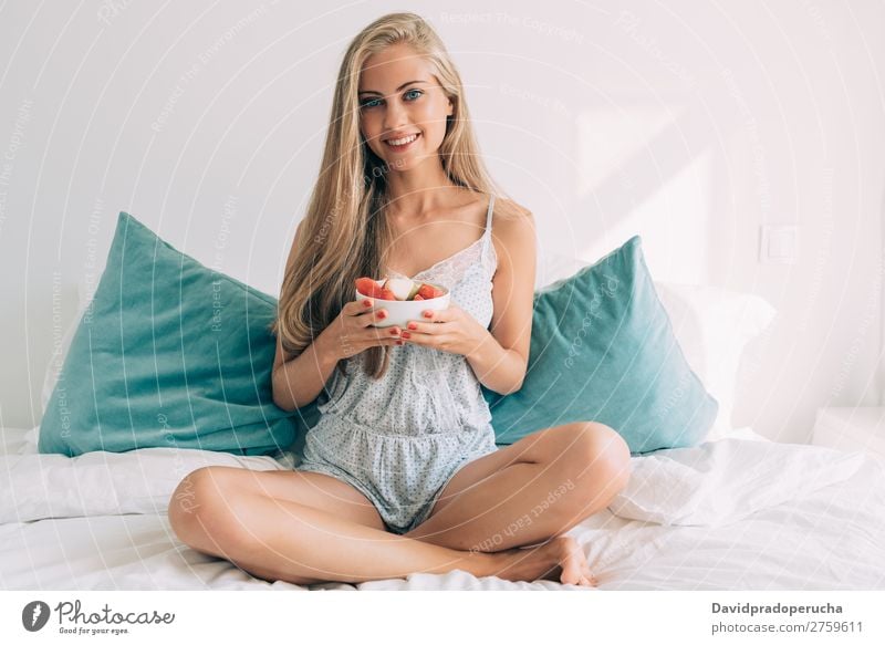 Young healthy beautiful blonde woman in the bed eating fruits Woman Bed Bedroom Blonde Portrait photograph Fruit Food To feed Smiling Youth (Young adults) Girl