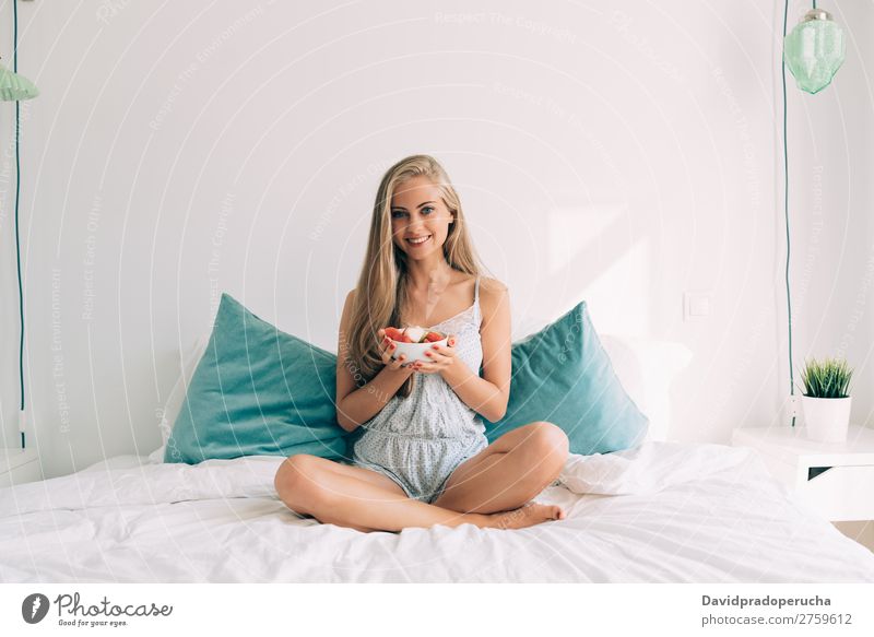 Young healthy beautiful blonde woman in the bed eating fruits Woman Bed Bedroom Blonde Portrait photograph Fruit Food To feed Smiling Youth (Young adults) Girl