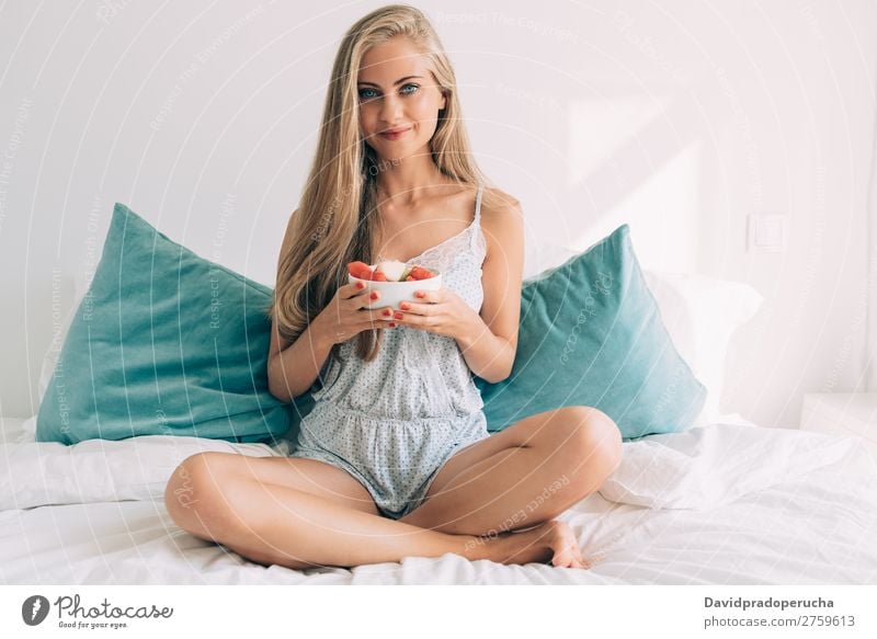 Young healthy beautiful blonde woman in the bed eating fruits Woman Bed Bedroom Blonde Portrait photograph Fruit Food To feed Smiling Youth (Young adults) Girl