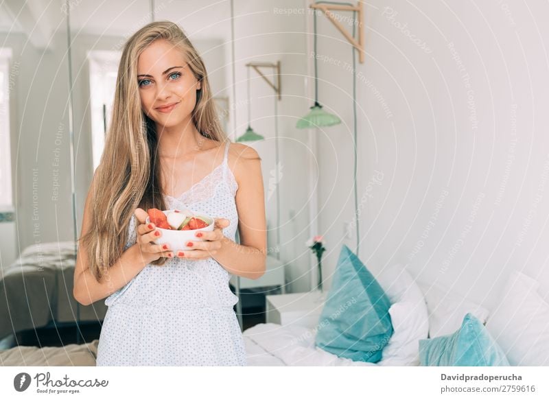 Young healthy beautiful blonde woman in the bed eating fruits Woman Bed Bedroom Blonde Portrait photograph Fruit Food To feed Smiling Youth (Young adults) Girl