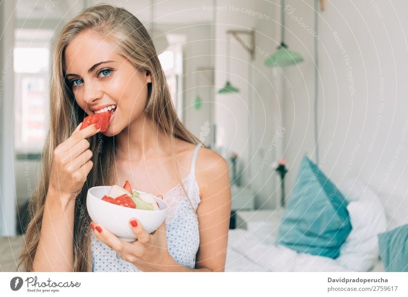 Young healthy beautiful blonde woman in the bed eating fruits Woman Bed Bedroom Blonde Portrait photograph Fruit Food To feed Smiling Youth (Young adults) Girl