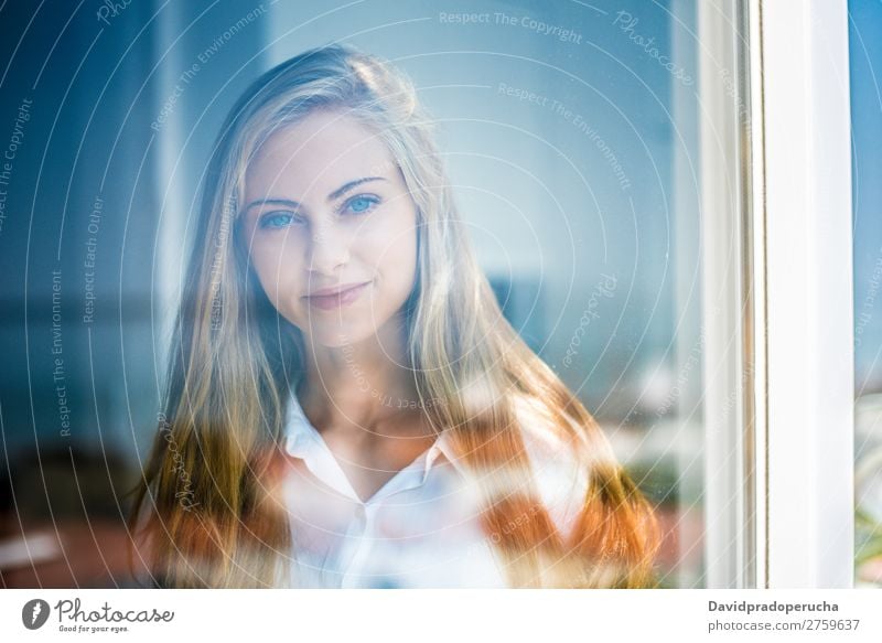 Young thoughtful woman looking through the window Woman Blonde Youth (Young adults) Considerate pretty Portrait photograph Window Close-up Life Home Happy