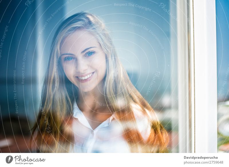 Young thoughtful woman looking through the window Woman Blonde Youth (Young adults) Considerate pretty Portrait photograph Window Close-up Life Home Happy