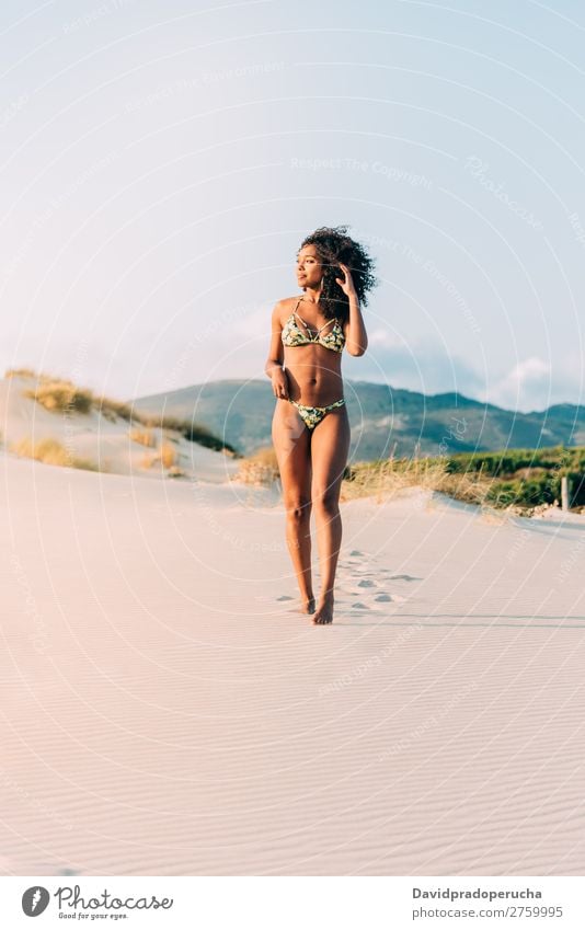 Beautiful young woman posing on the sand in the beach Beach Sand pose Woman Human being Isolated romantic Ocean Sun Vacation & Travel Nature Swimming Suit Joy