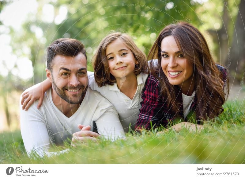 Happy young family in a urban park. Lifestyle Joy Beautiful Summer Child Human being Woman Adults Man Parents Mother Father Family & Relations Infancy 3 Group