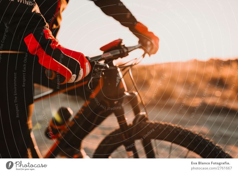 close up Cyclist glove and handlebar.Man Riding Bike.Sports Lifestyle Relaxation Adventure Summer Sun Mountain Cycling Adults Nature Landscape Sky Hill Rock