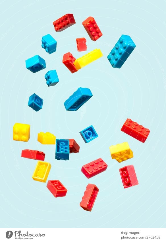 Floating Plastic geometric cubes in the air. Construction toys Design Playing Child Infancy Toys Brick Build Movement Blue Colour blocks falling background rows