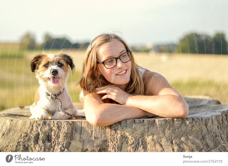 Young woman with enem dog on a tree trunk Lifestyle Leisure and hobbies Tree trunk Trip Summer Feminine Youth (Young adults) 1 Human being 18 - 30 years Adults