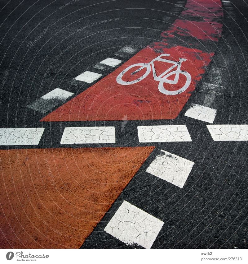 rolling home Transport Traffic infrastructure Street Marker line Cycle path Fat Sharp-edged Town Orange Red Black White Symbols and metaphors Bicycle