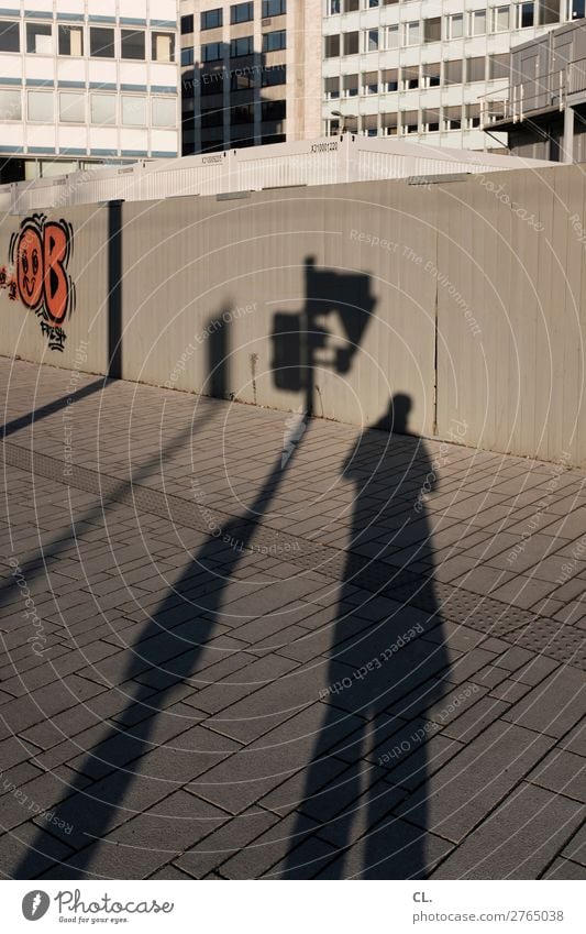 traffic light man Human being Masculine Man Adults 1 Beautiful weather Duesseldorf Town Downtown House (Residential Structure) High-rise Wall (barrier)