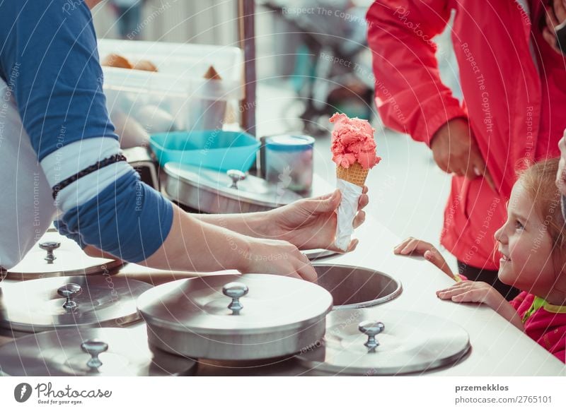 Little girl waiting for icecream Dessert Ice cream Eating Lifestyle Shopping Happy Summer Child Mother Adults Street To enjoy Smiling Sell Small Delicious