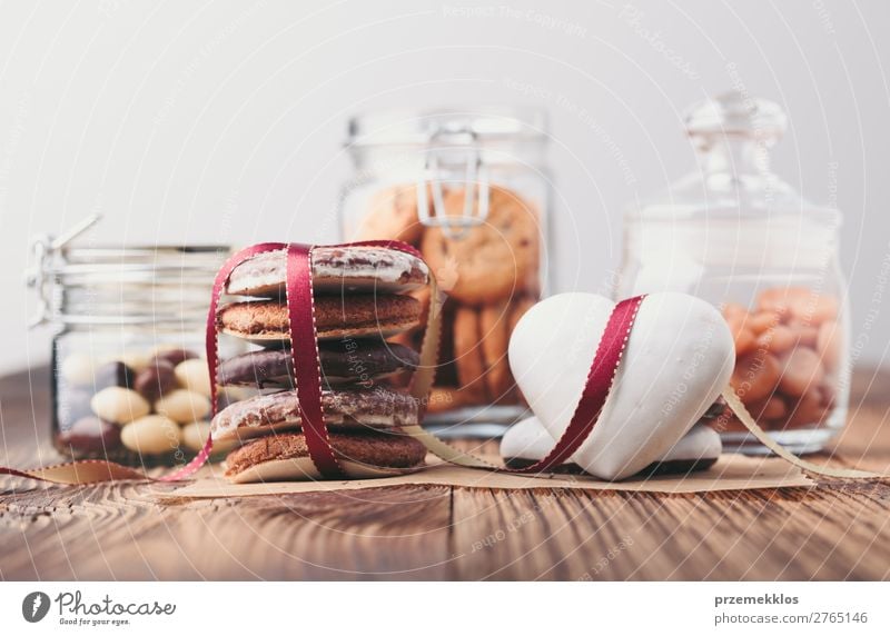 Gingerbread cookies, candies, cakes in jars on wooden table Dessert Nutrition Eating Diet Lifestyle Table Heart To enjoy Delicious Brown Baking Bakery biscuit