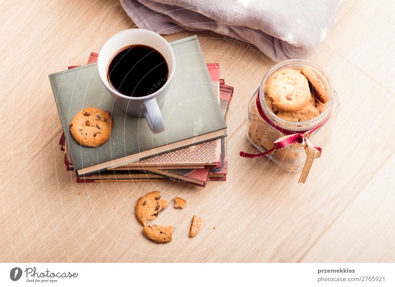 A few books with cup of coffee and cookies on wooden floor Dessert Nutrition Eating Diet Coffee Mug Lifestyle Relaxation Leisure and hobbies Reading Table Book