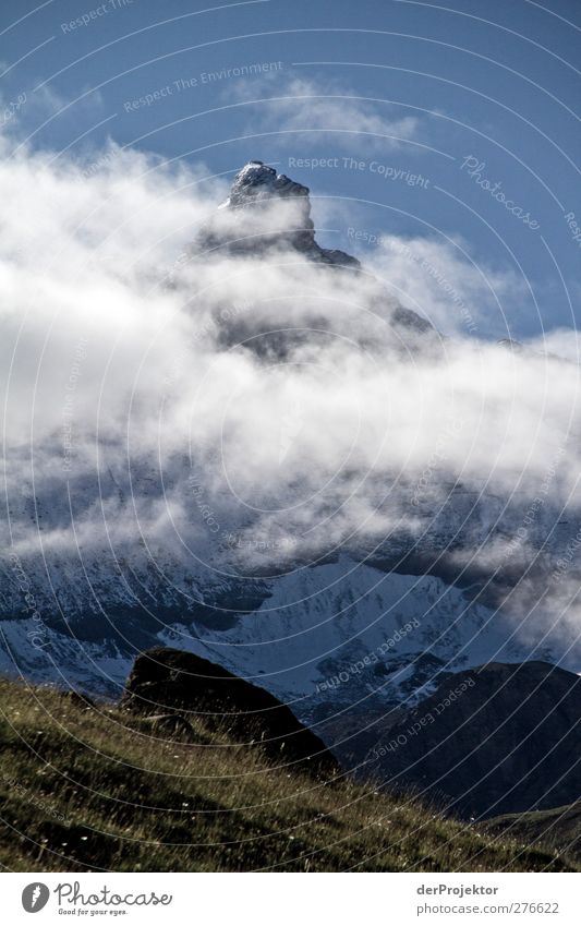 It is not the matterhorn Environment Nature Plant Clouds Sun Summer Alps Mountain Peak Snowcapped peak Dark Gigantic Positive Blue Moody Dream Savoie