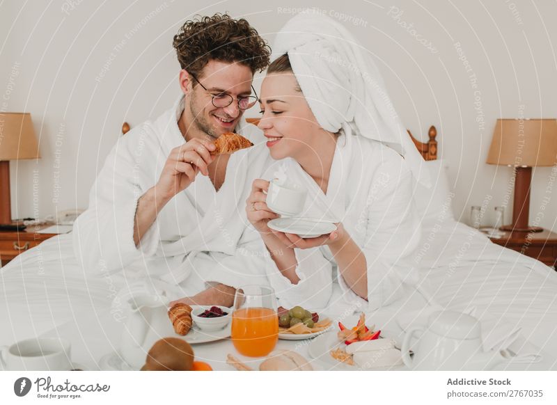 Couple having breakfast in hotel Eating Breakfast Together Room service Bathrobe Hotel Bedroom Home Interior design Furniture Flat (apartment) Design