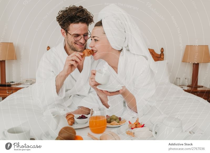 Couple having breakfast in hotel Eating Breakfast Together Room service Bathrobe Hotel Bedroom Home Interior design Furniture Flat (apartment) Design