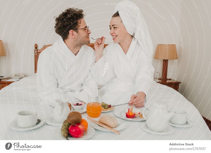 Couple having breakfast in hotel Eating Breakfast Together Room service Bathrobe Hotel Bedroom Home Interior design Furniture Flat (apartment) Design