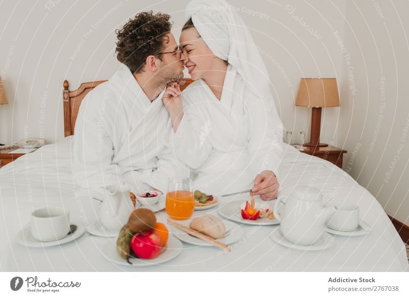 Couple having breakfast in hotel Eating Breakfast Together Room service Bathrobe Hotel Bedroom Home Interior design Furniture Flat (apartment) Design