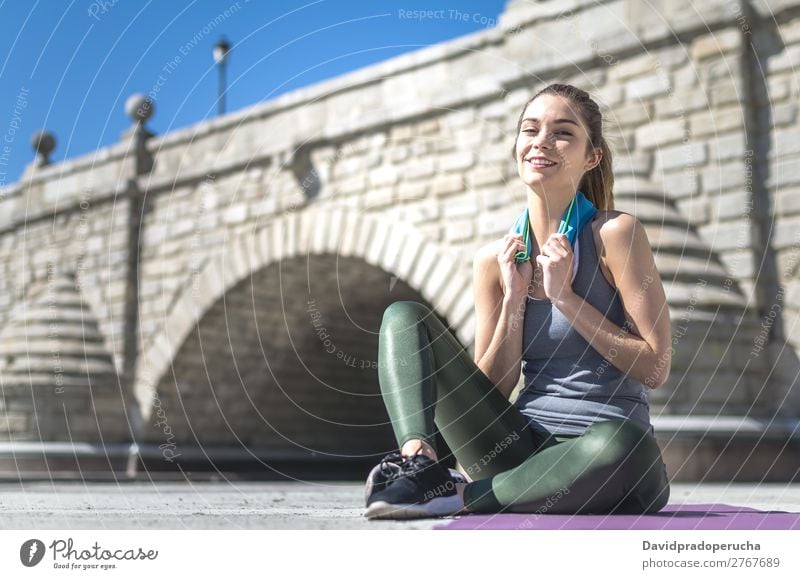 Woman resting and drinking water with towel after workout Lifestyle Beautiful Body Relaxation Meditation Sports Yoga Human being Adults Nature Warmth Park