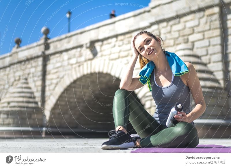 Woman resting and drinking water with towel after workout Lifestyle Beautiful Body Relaxation Meditation Sports Yoga Human being Adults Nature Warmth Park