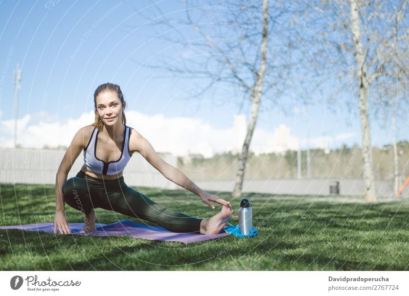 woman doing yoga and pilates outdoor with her mat Lifestyle Beautiful Body Relaxation Meditation Sports Yoga Human being Woman Adults Nature Warmth Park