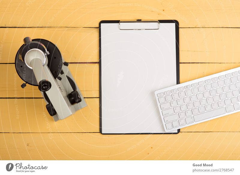 microscope, blank clipboard, computer keyboard on yellow desk Health care Medication Desk Table Science & Research School Study Classroom Academic studies