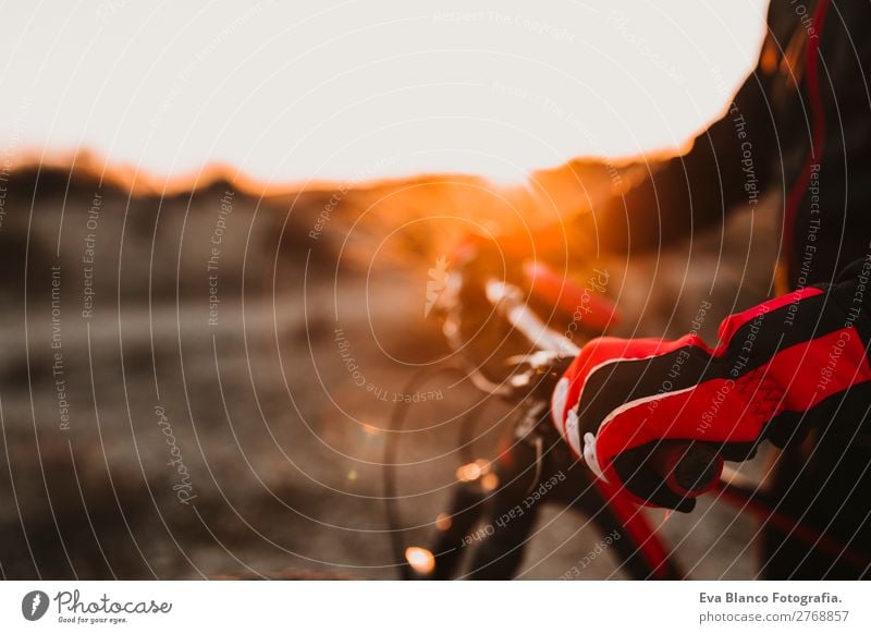 close up view of a Cyclist equipment and handlebar. Lifestyle Relaxation Leisure and hobbies Adventure Summer Sun Mountain Sports Cycling Masculine Young man