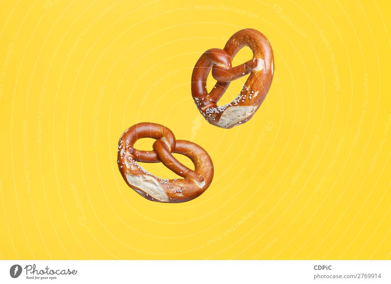 Flying Food Concept German Traditional Salted Pretzel Bread Fresh Delicious Soft bretzel market background Salty eat Snack salt pretzels Baked goods german