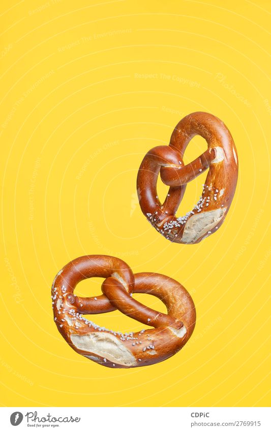 Flying Food Concept German Traditional Salted Pretzel Bread Fresh Delicious Soft bretzel market background food Salty eat Snack salt pretzels Baked goods german