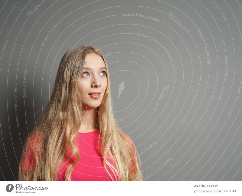 young woman looks up at the text space Human being Feminine Young woman Youth (Young adults) Woman Adults 1 13 - 18 years 18 - 30 years Wall (barrier)