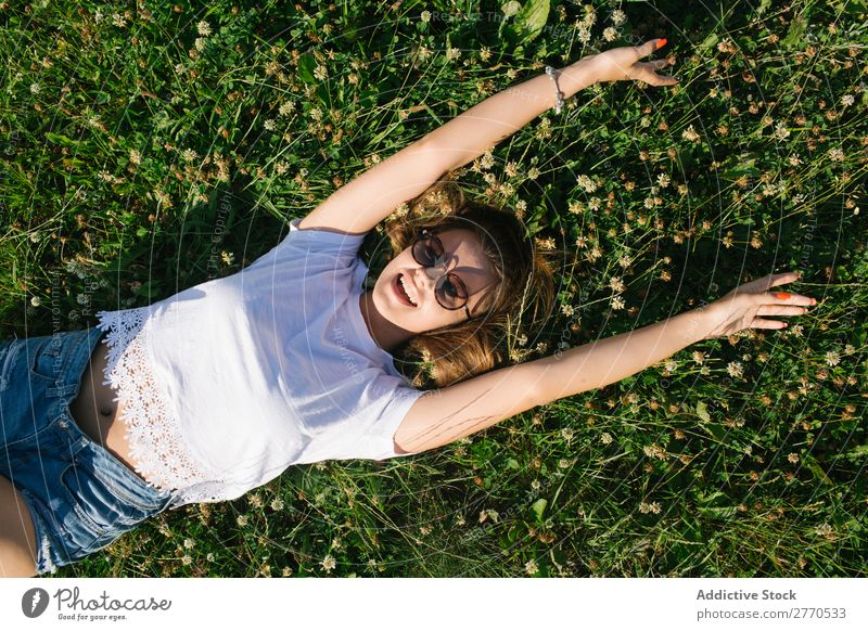 Confident girl posing in green field Woman Field Lie (Untruth) Cheerful Posture Happiness Easygoing Freedom Nature Summer Landscape Meadow romantic Fresh Dream