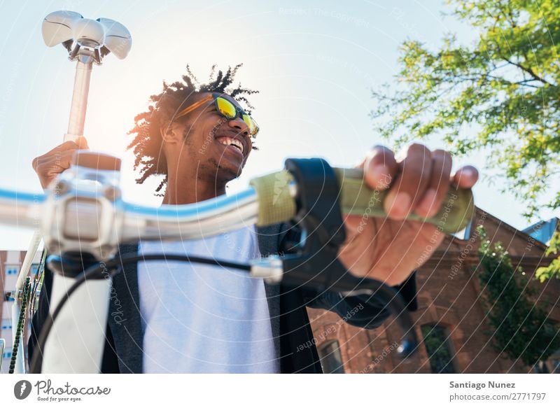 Handsome afro man riding a bike. Man Youth (Young adults) Afro Black mulatto African Bicycle fixie Hipster Lifestyle Cycling City Town Human being handsome