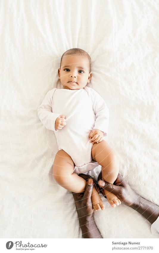 Cute Baby Girl Lying in the Crib Boy (child) Child Cot Lie (Untruth) Newborn cots multiethnic Parents Hand African diverse Human being interracial Caucasian